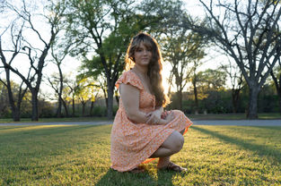 Alexis Posing at sunset in city park 