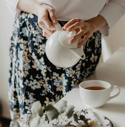 woman pouring tea
