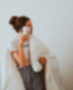 tired woman with a duvet