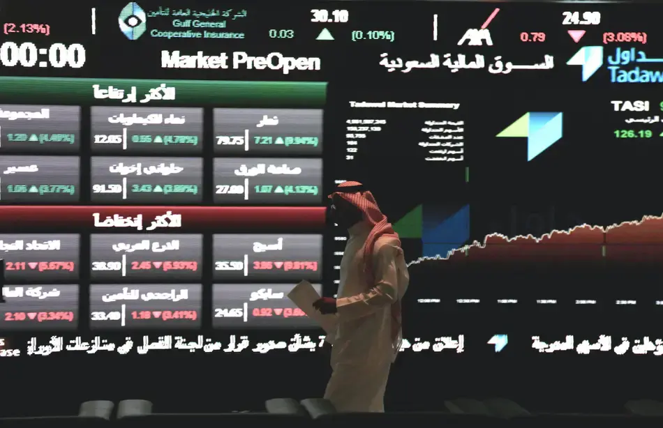 Alamy | A Saudi man at the Tadawul stock exchange in Riyadh. A higher foreign-ownership limit is likely to prompt an increase in funds that invest in the market