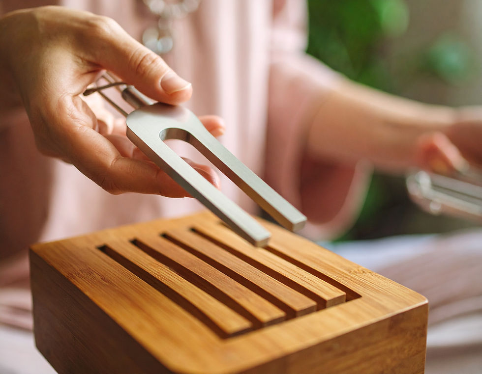 Close-up view of tuning forks set on a wooden surface