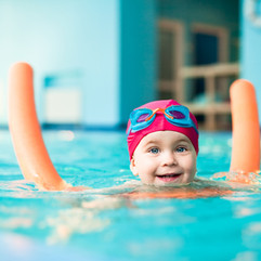 Happy swimmer with a noodle