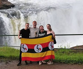 visitors standing on waterfall