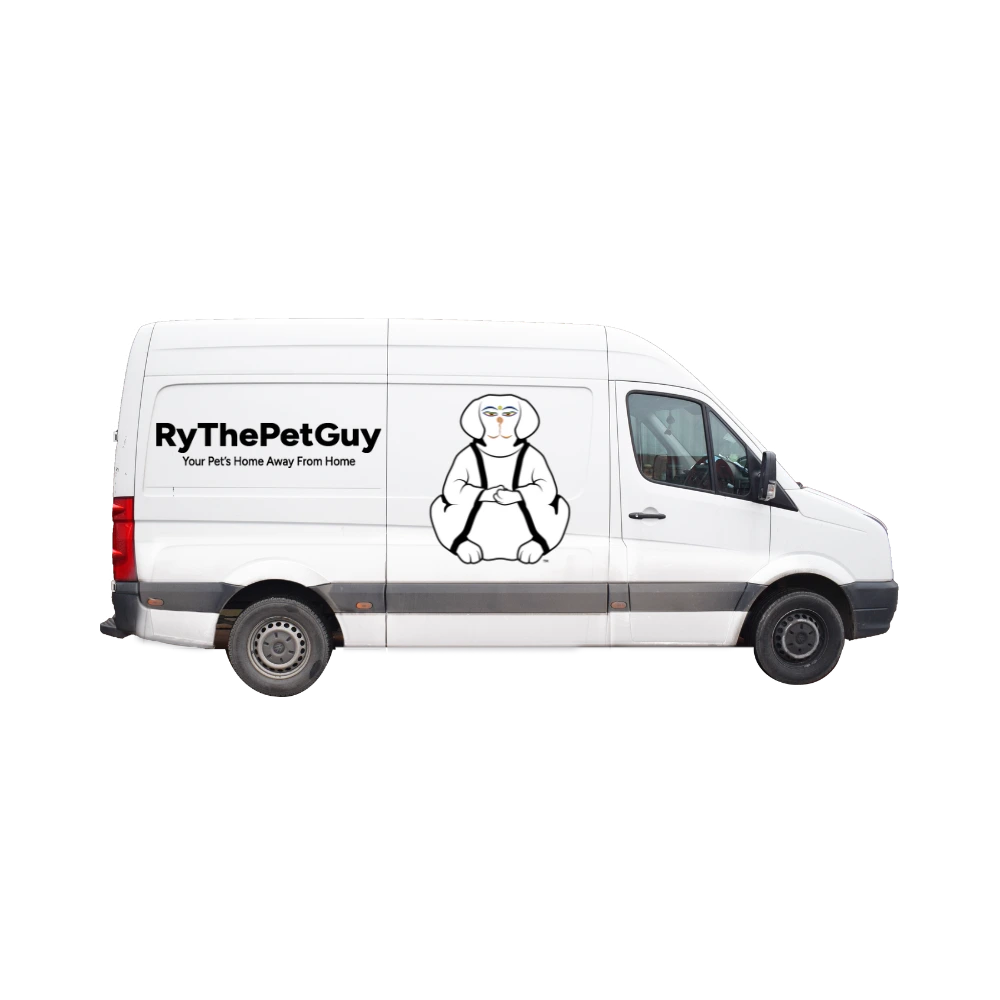 White service van with RyThePetGuy wordmark and mascot logos on the sides of the van. The van is featuring the door to door pick-up and drop-off dog daycare service