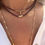 Miniature : Collier grenat croix