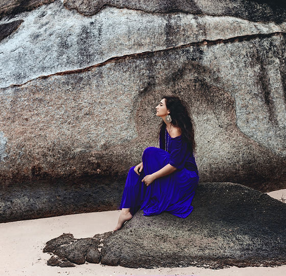 Woman Sitting on Stone