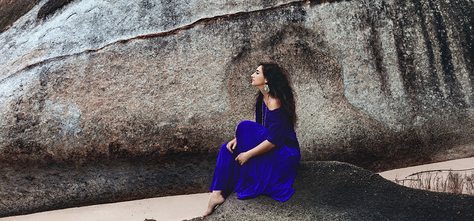 Woman Sitting on Stone