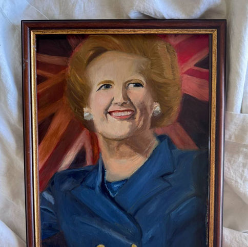 Margaret Thatcher standing in front of the Union Flag.
