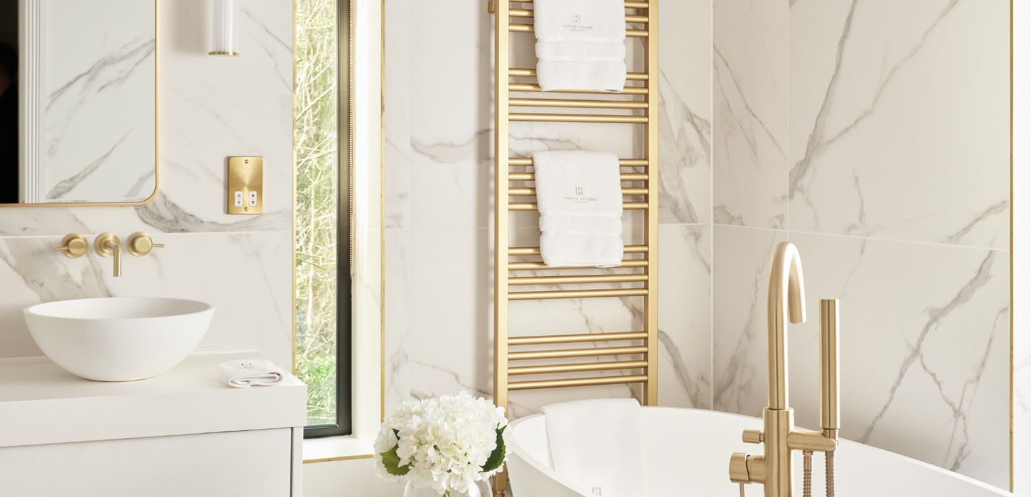 Luxurious white marble bathroom with free-standing tub