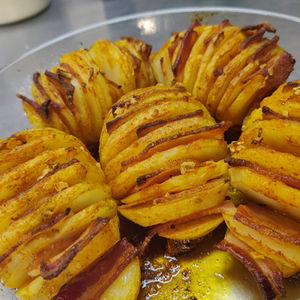 Oven roasted Hasselback potatoes with bacon