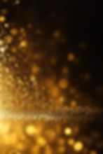 golden-glitter-lights-isolated-dark-background-gold-glitter-dust-defocused-texture-abstrac