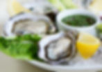 Oysters with lemons on a dish
