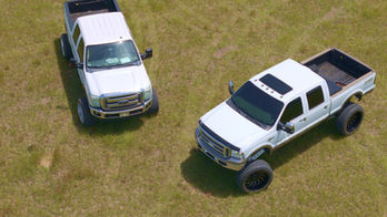two trucks with aftermarket lift kits and suspension from tri-state truck accessories
