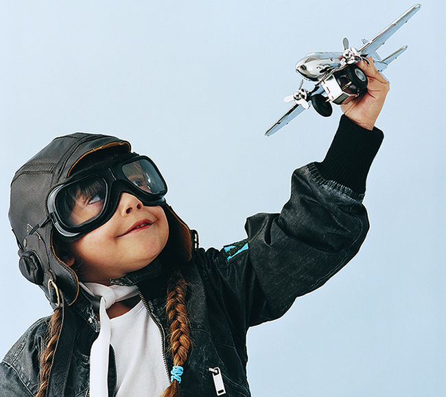 Child Holding Toy Plane
