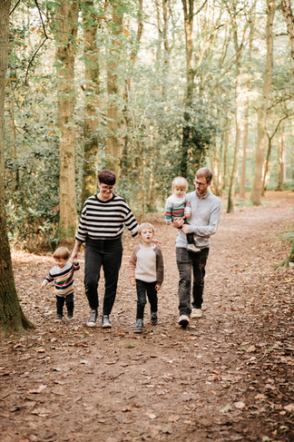 family walking in woods