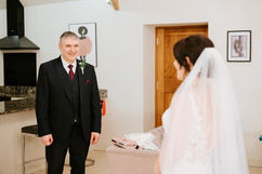 Father smiling at Bride on wedding morning