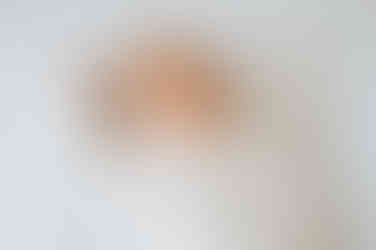 Newborn baby boy natural light studio portrait in Burbage Leicestershire showing tiny hands and peaceful expression