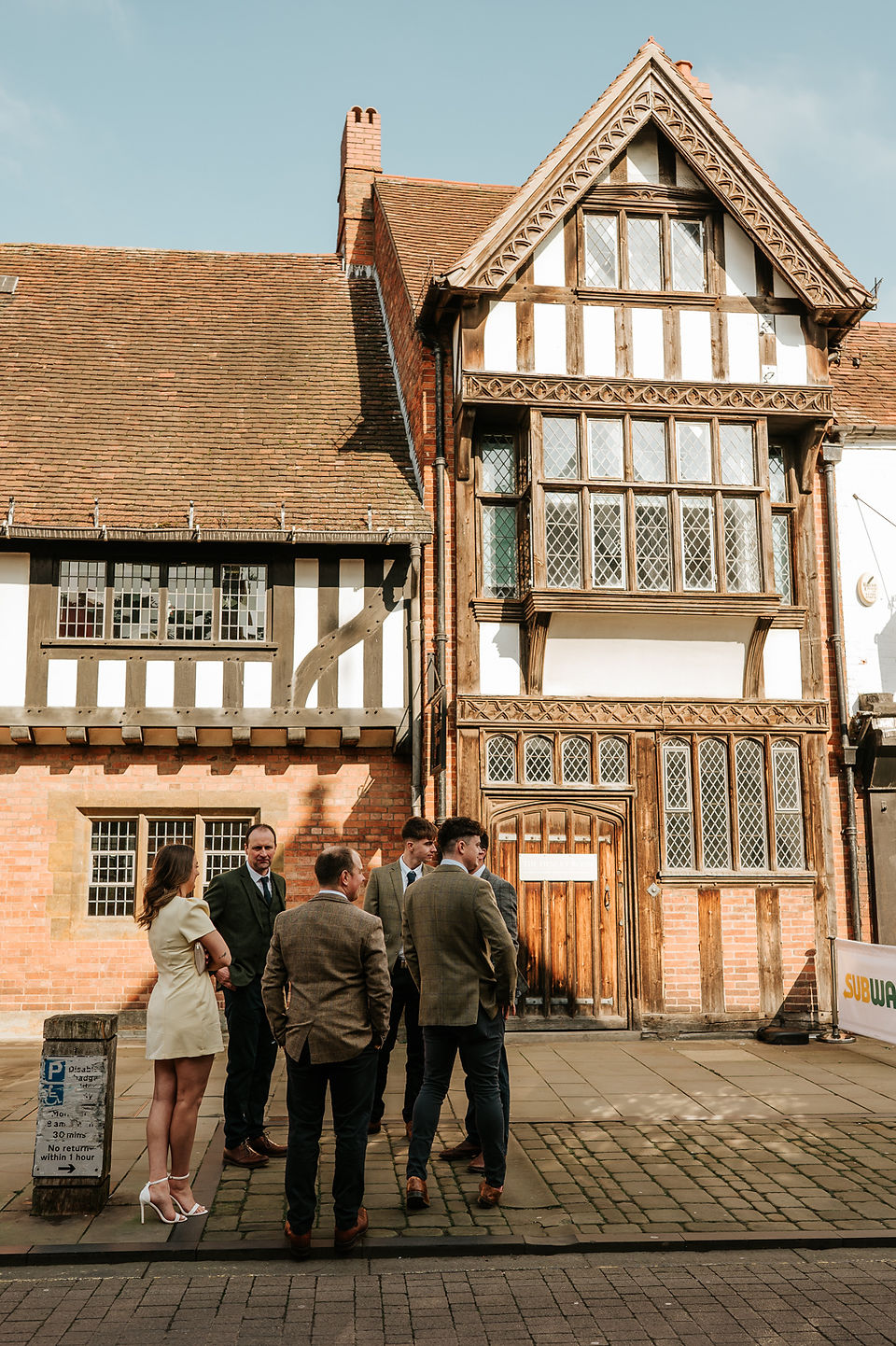 A group of people stood outside Stratford Upon Avon building