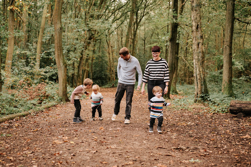 family walking in woods