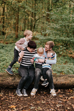 family sat on log
