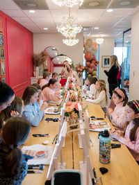 Girls enjoying glam party makeup lesson