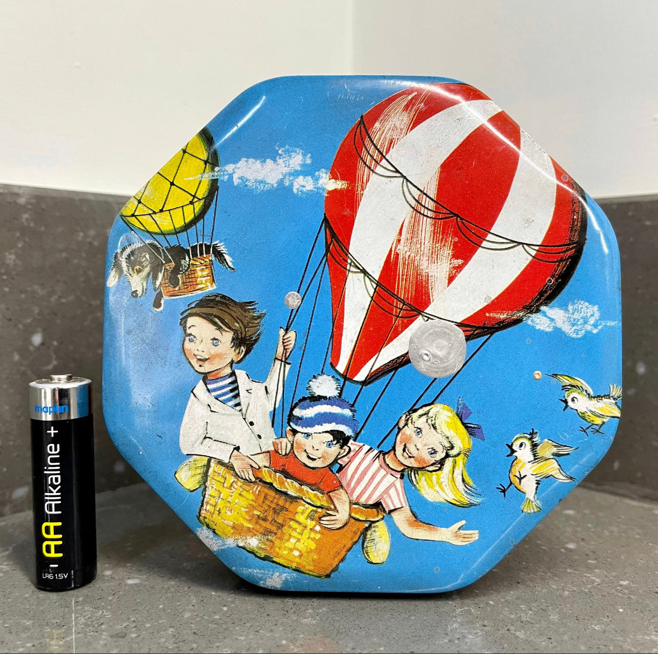 Vintage toffee tin. Children in hot air balloon.
