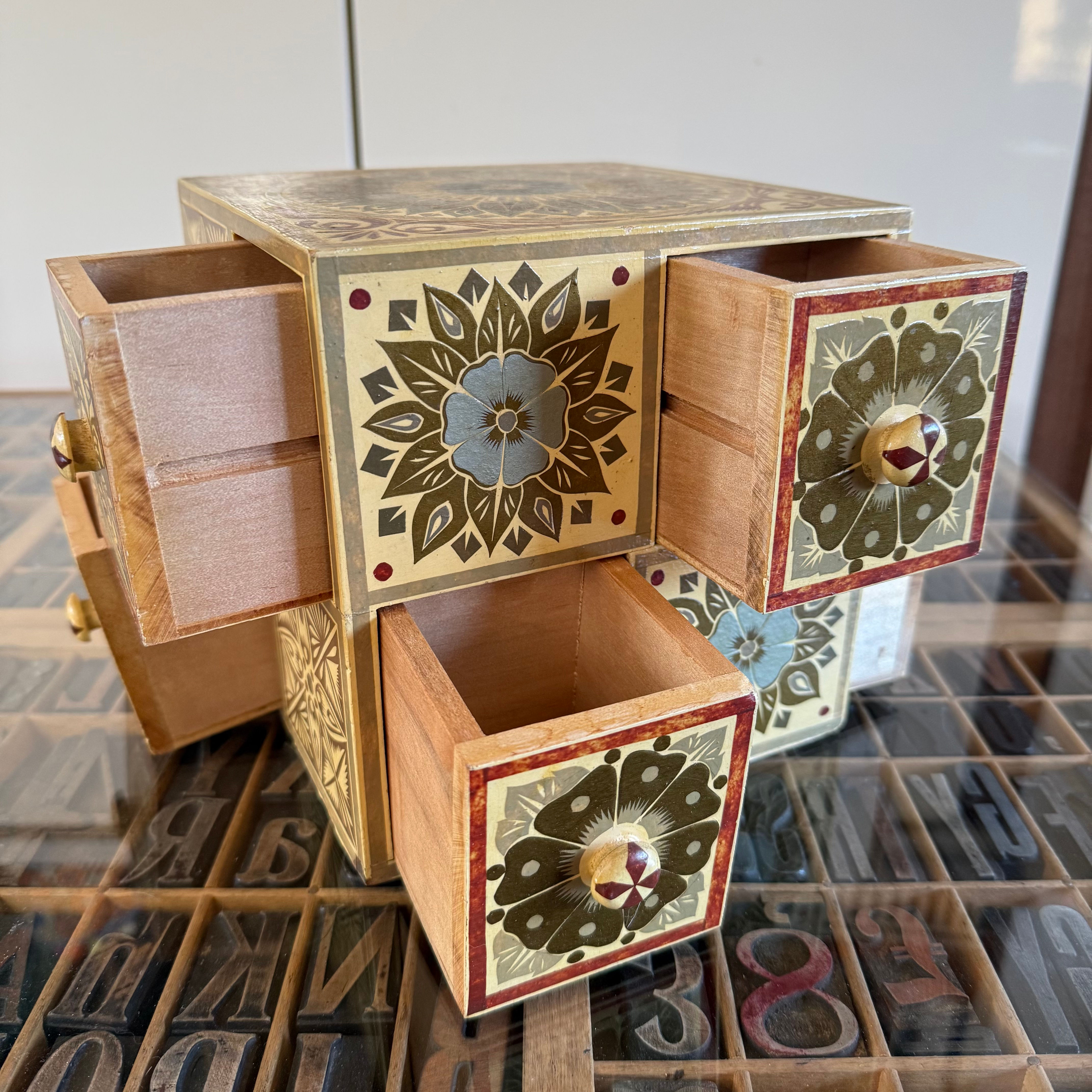Unusual Indian style storage cube with 8 drawers