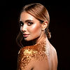 Firefly Image of a beautiful woman with hair gelled back against a dark background with fl