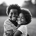 A black and White kids happy and hugging