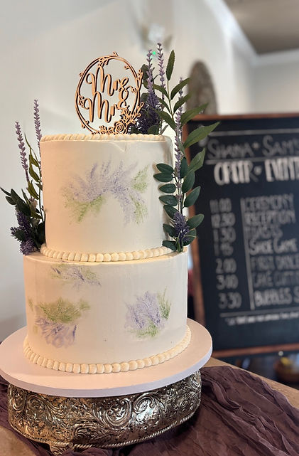 2 tier wedding cake with beatiful flowers and leaves