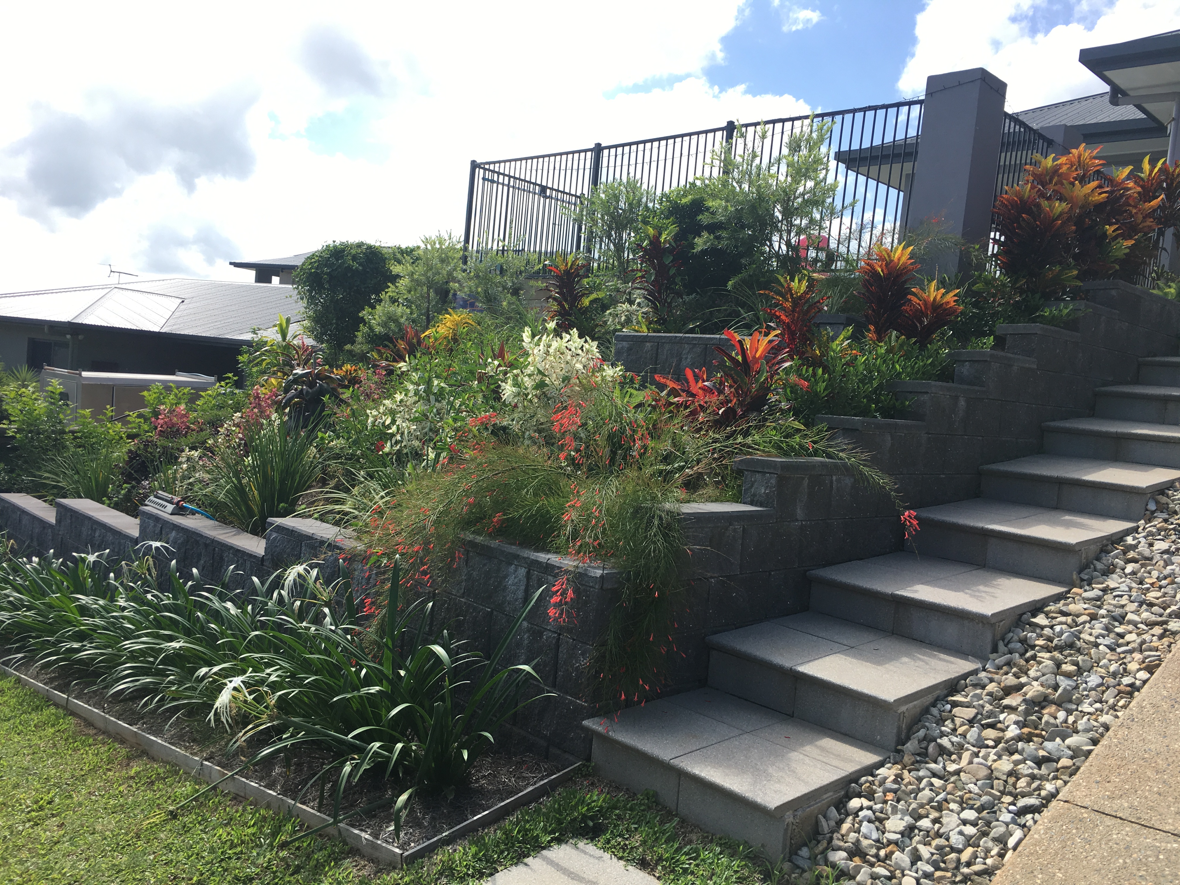 Retaining wall, planting and paving