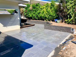 Retaining wall and paving