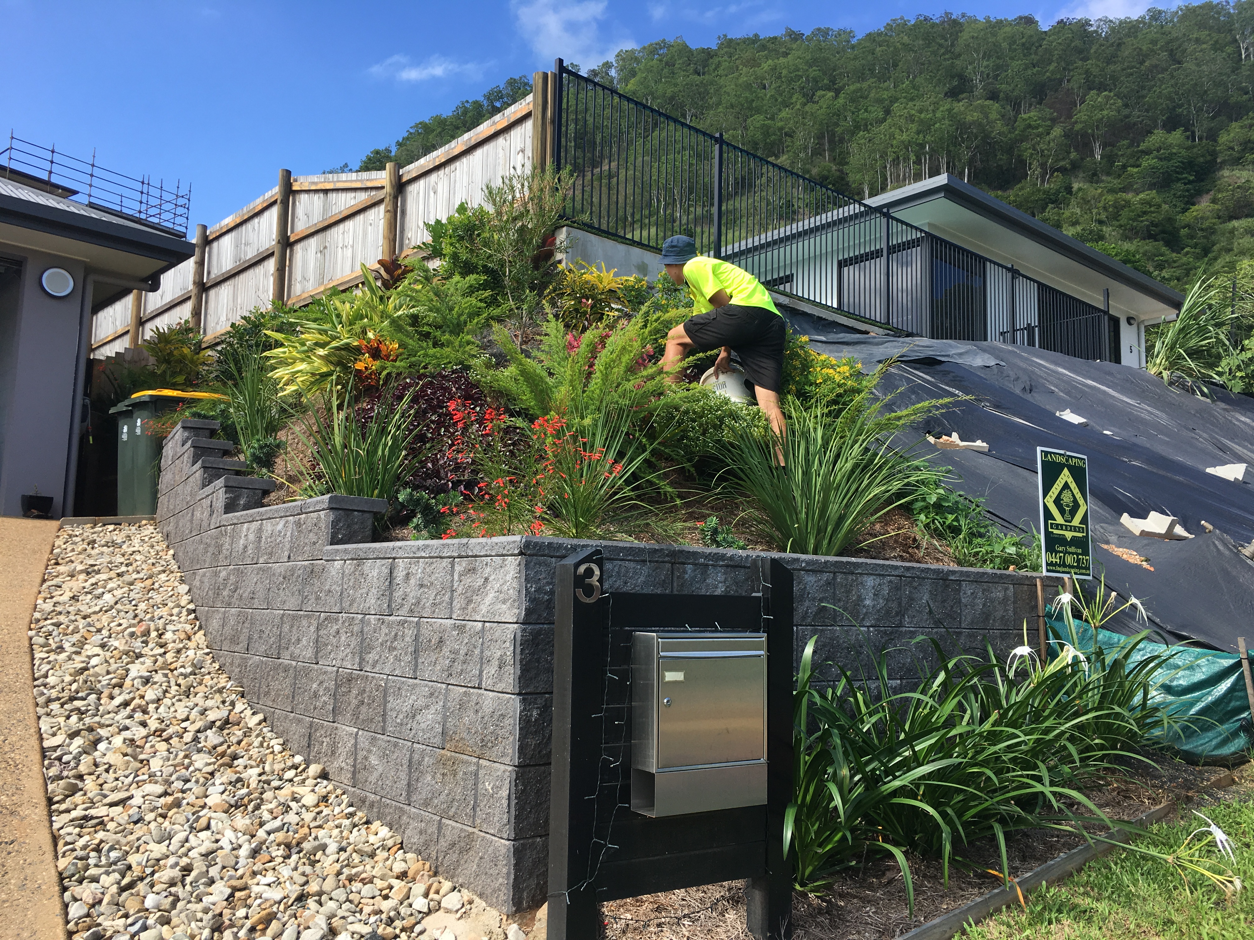 Retaining wall, planting and paving