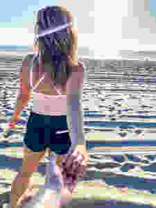 couples holding hands on beach