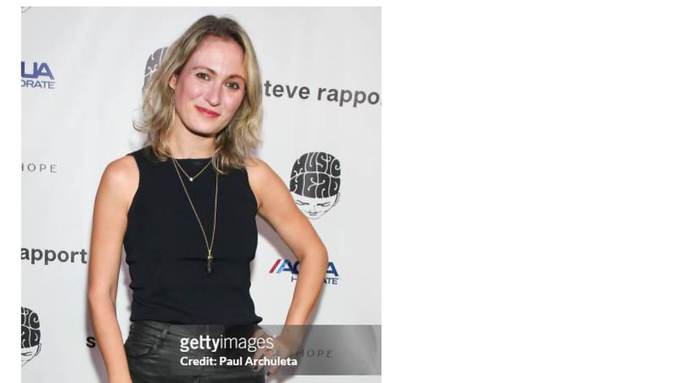 A person in a black outfit poses in front of a branded backdrop, showing confidence. Text includes "steve rapport" and "Getty Images."
