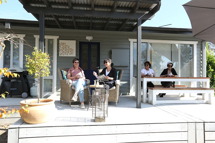 Guests enjoying the alfresco area at Acorn Cottage