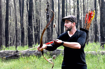 Andy as he draws his bow to take a shot