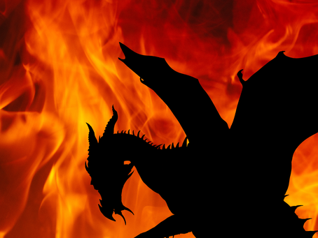Tiny human faces a giant black dragon silhouette amid roaring orange flames, creating a tense, ominous scene.