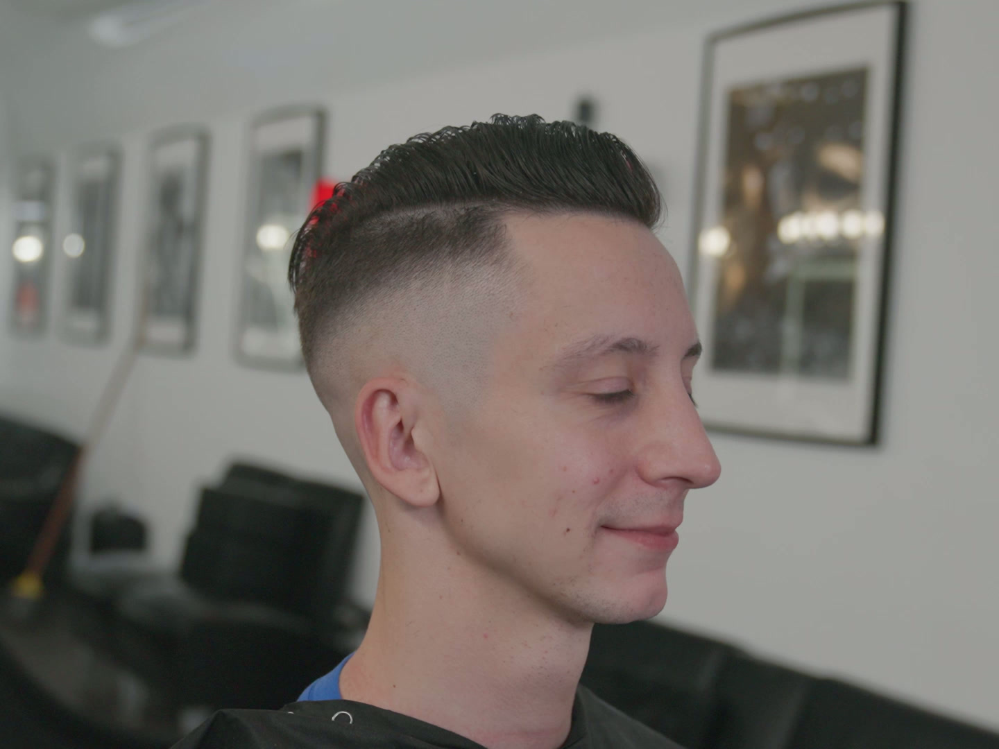 Short slicked-back haircut with skin fade on the sides