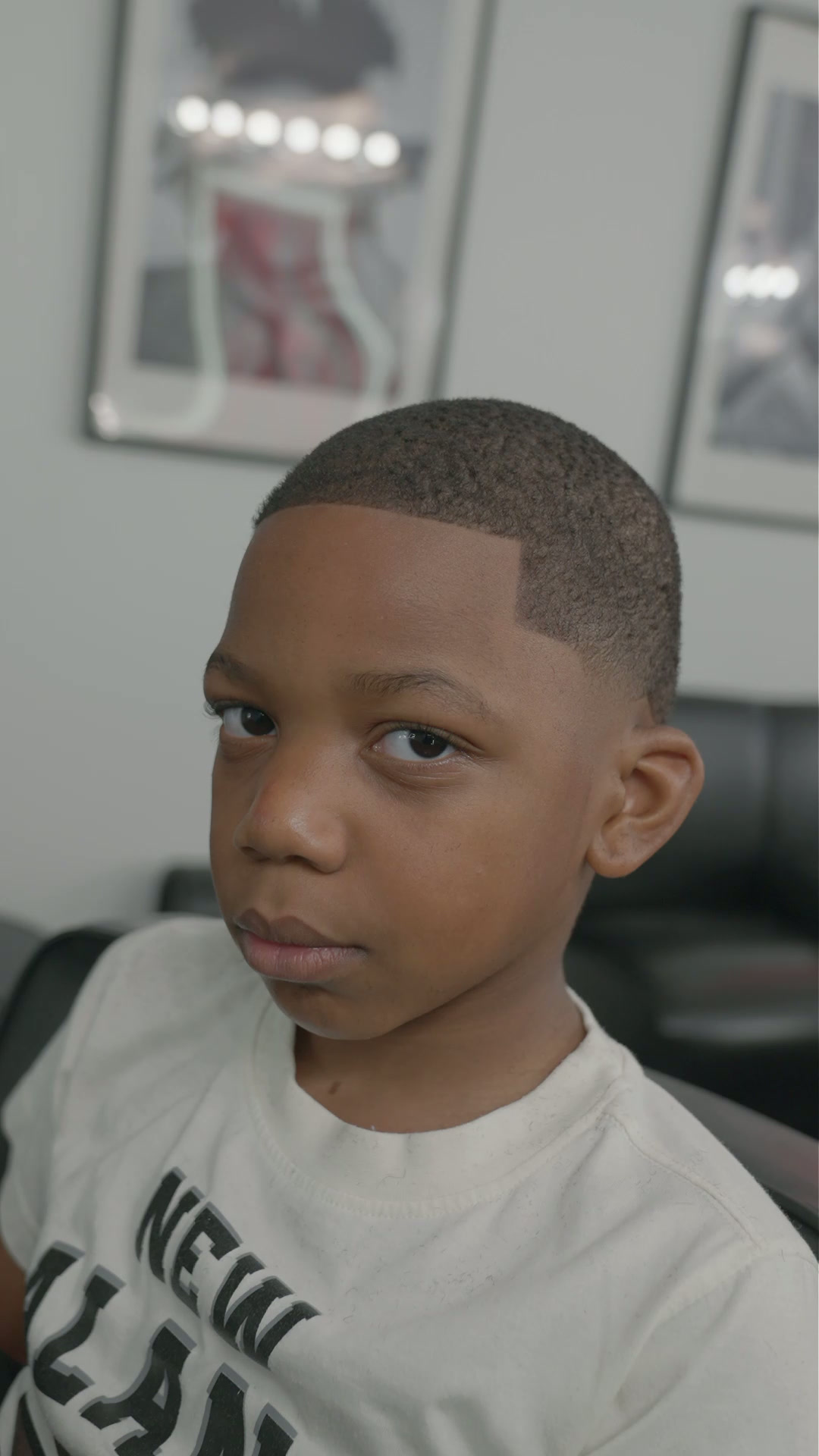 Child's low taper haircut with defined part in the shop