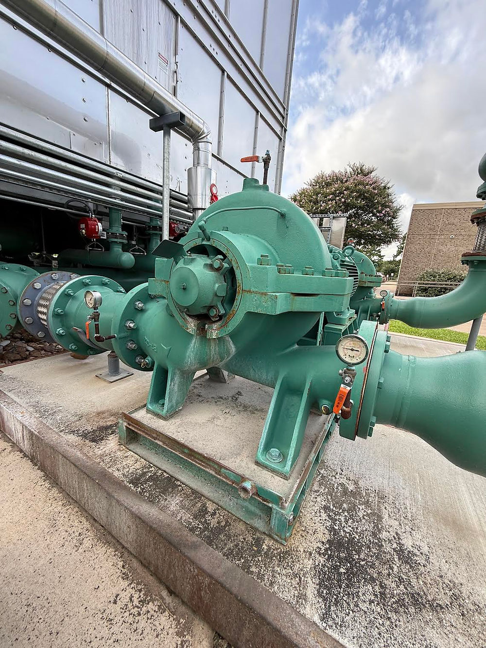Green centrifugal pump in an outdoor industrial facility