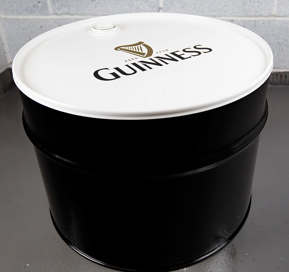 Oil drum table with "Guinness" logo, links to tables store category.