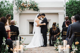 Couple receiving a sage blessing at the altar