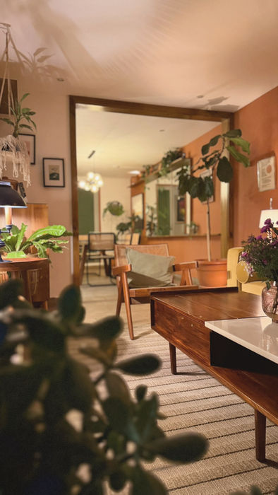 Living room filled with plants inside The Greenhouse Residence