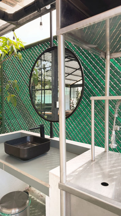 Hanging chair and relaxing lounge corner at Botanical Rooftop.