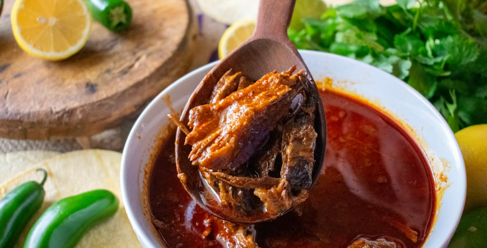 Traditional Guatemalan birria served in a rich, slow-cooked broth with fresh herbs, tortillas and local ingredients.