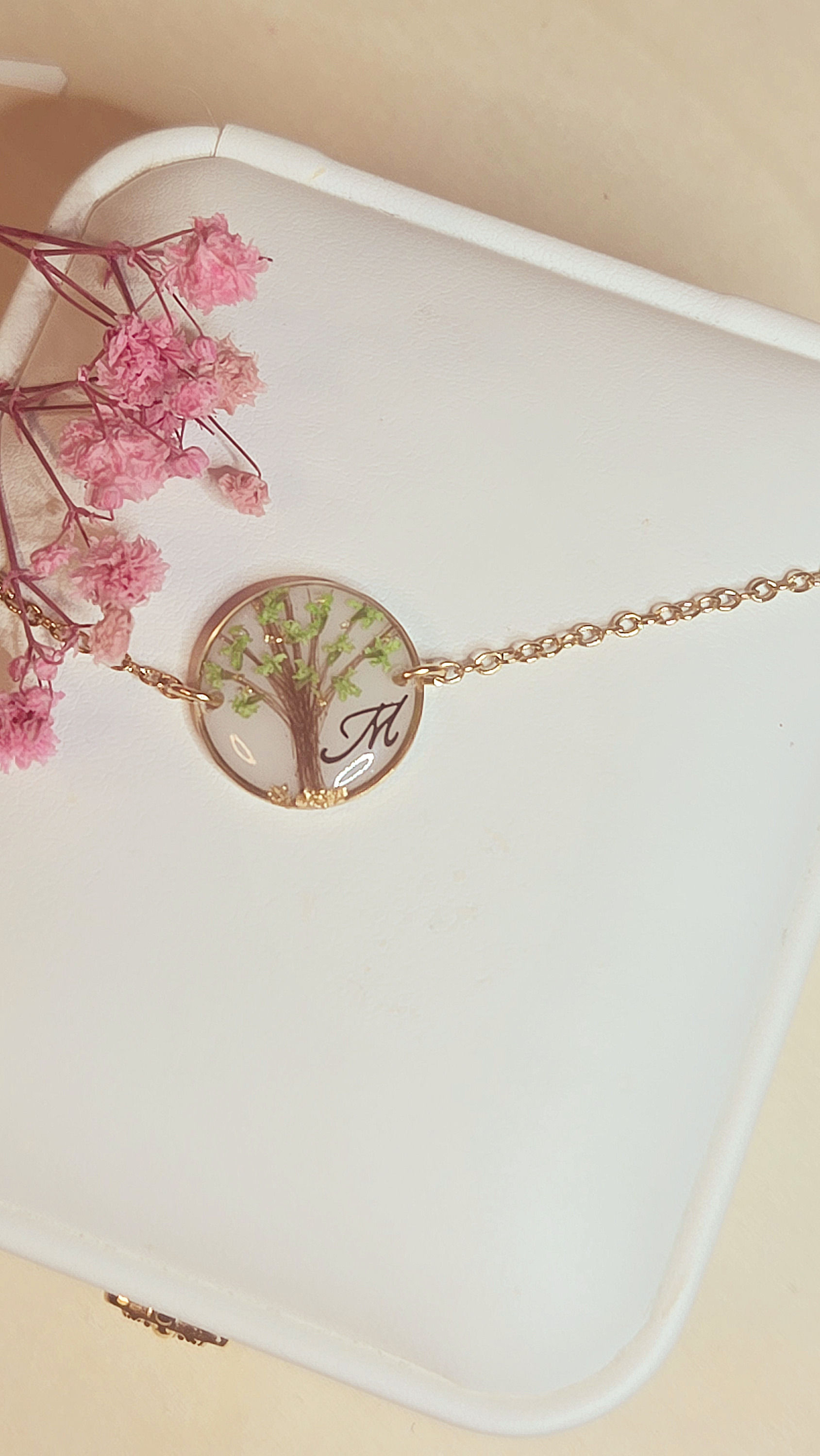 bijou souvenir avec cheveux arbre de vie