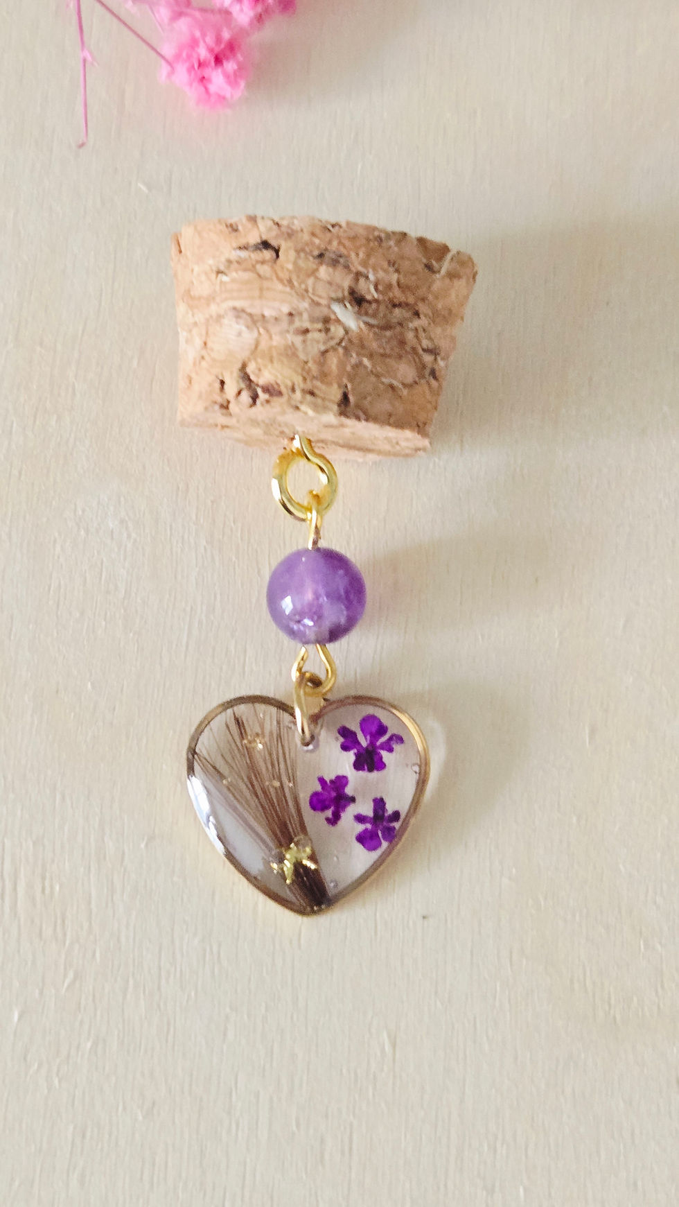 Fiole avec bijou cœur et mèche de cheveux