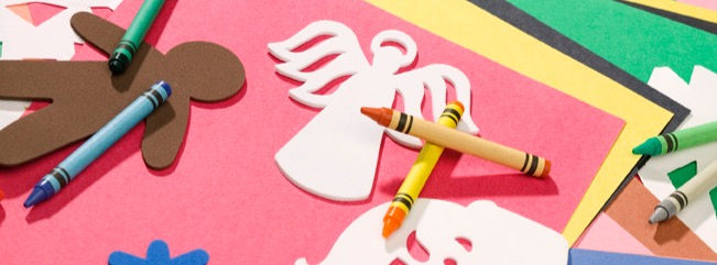 Crayons and colourful paper.