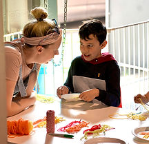 An adult women and a teenage boy having a conversation.